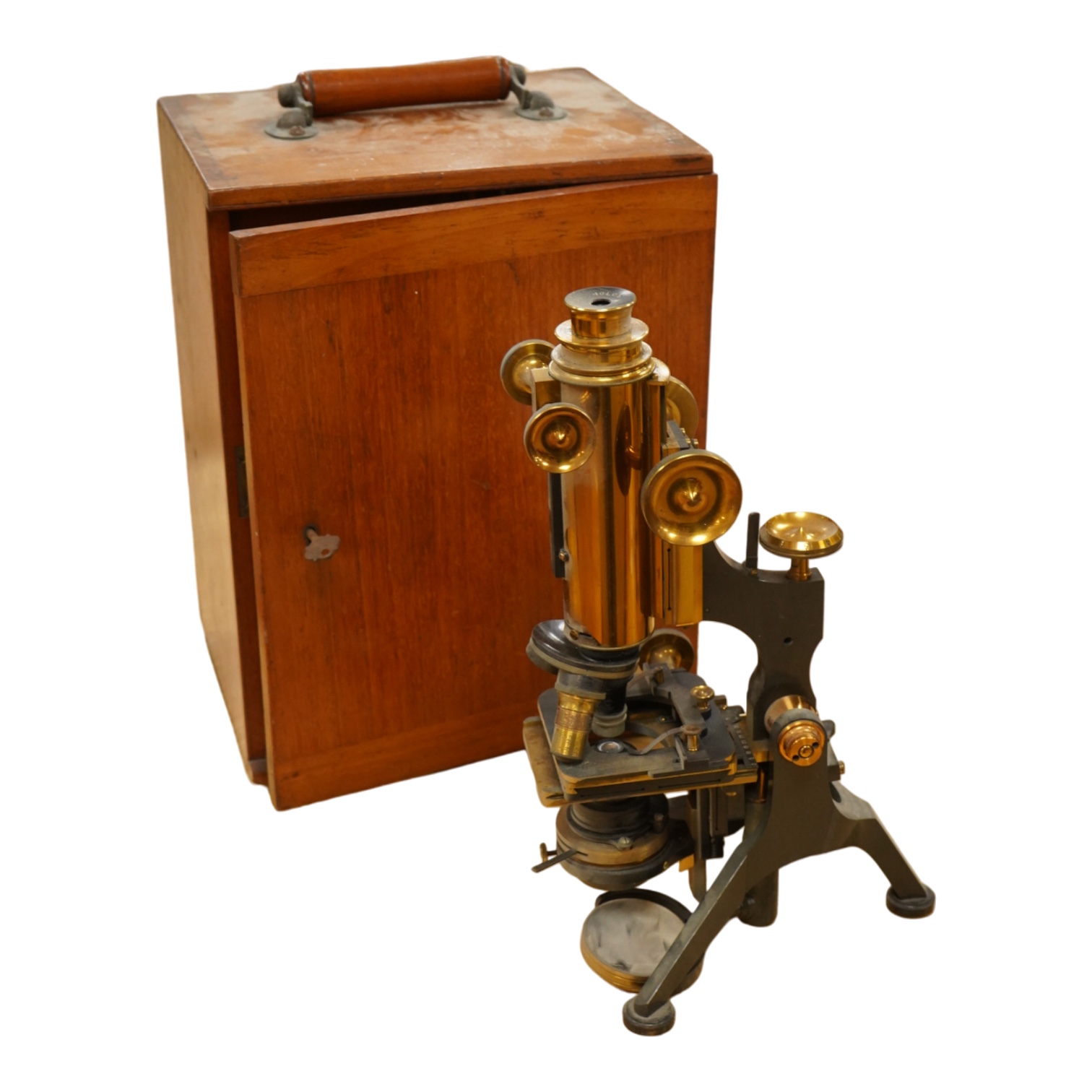 A early 20th century brass compound monocular microscope, by W. Watson and Sons, 313, High Holborn, London, number 9385, mahogany cased, with accessories including - four additional objectives, two eyepieces and a bull’s